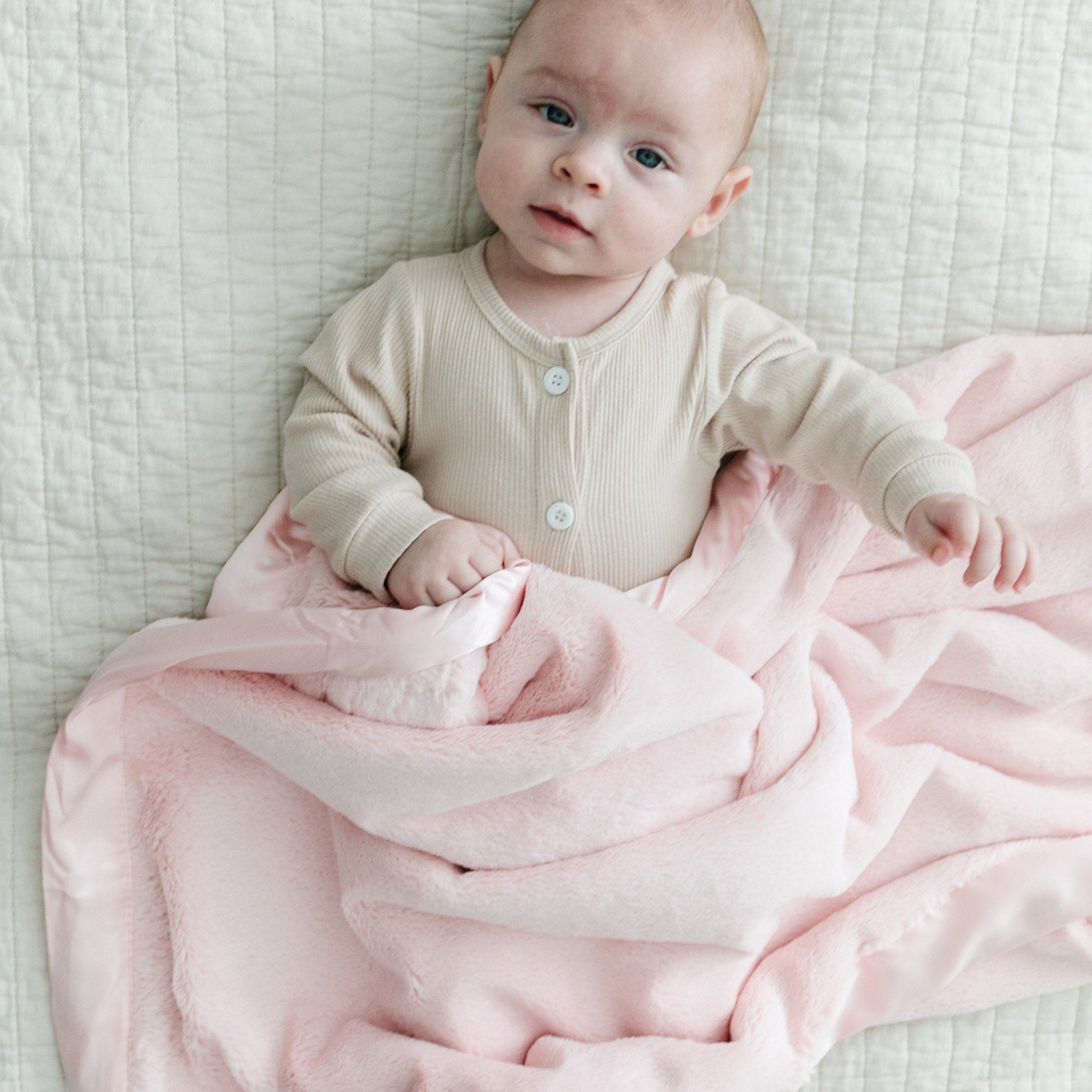 Warm and soft receiving blanket, offering a comforting embrace for your baby.