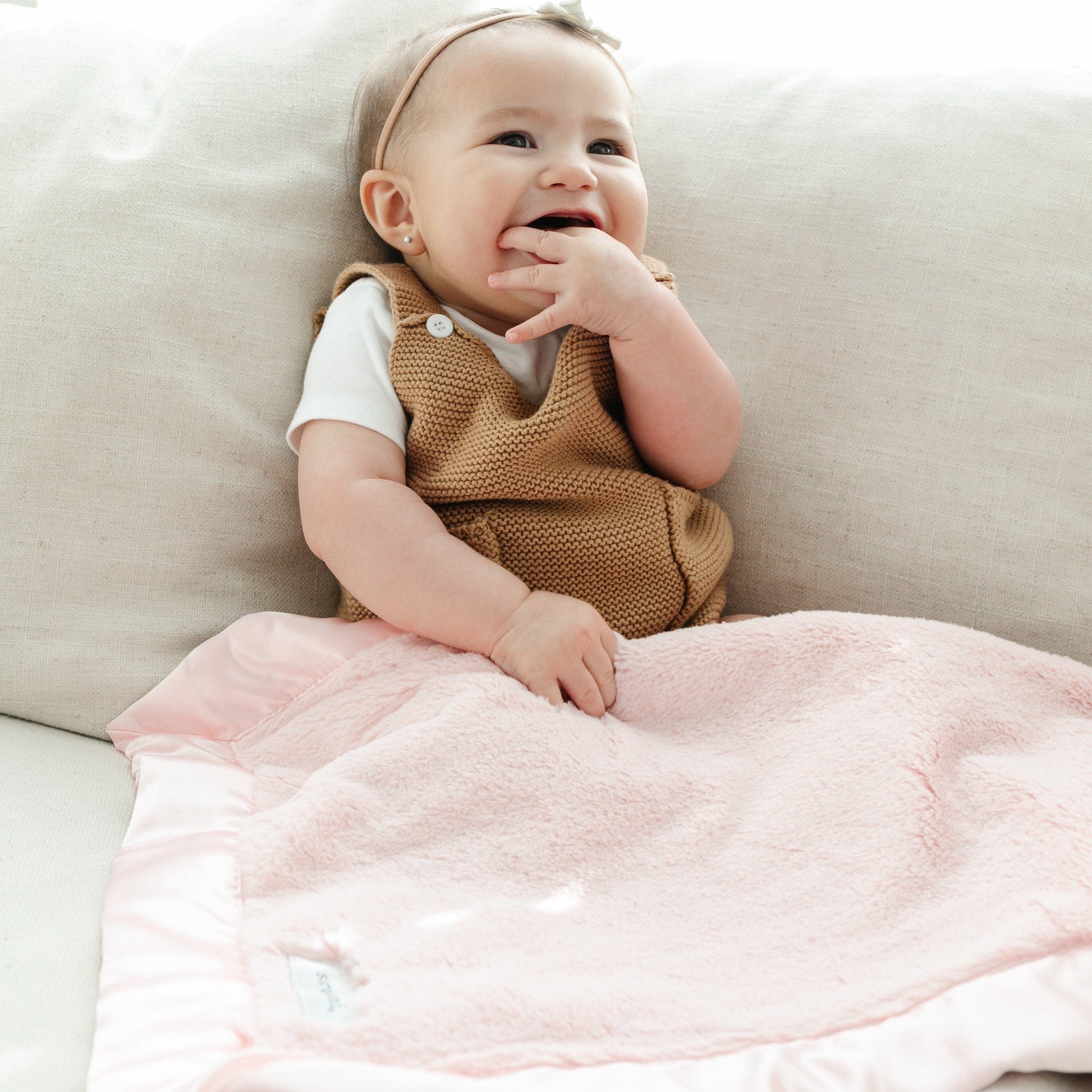 Warm and soft receiving blanket, offering a comforting embrace for your baby.