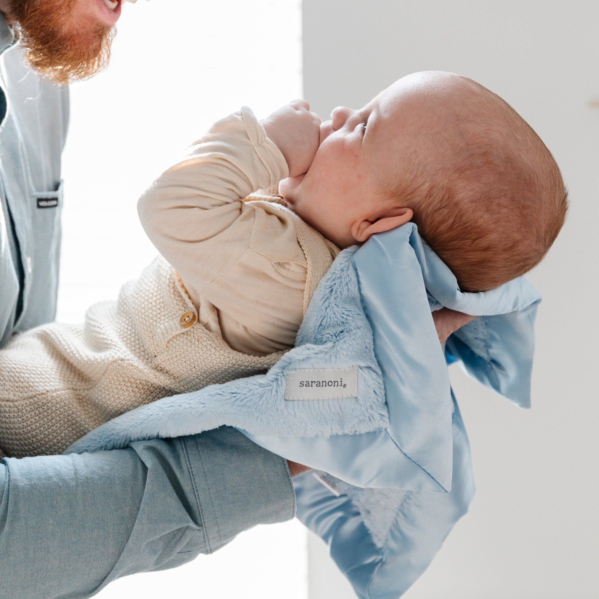 Lightweight and cozy blue receiving blanket, ideal for keeping your baby warm and secure.