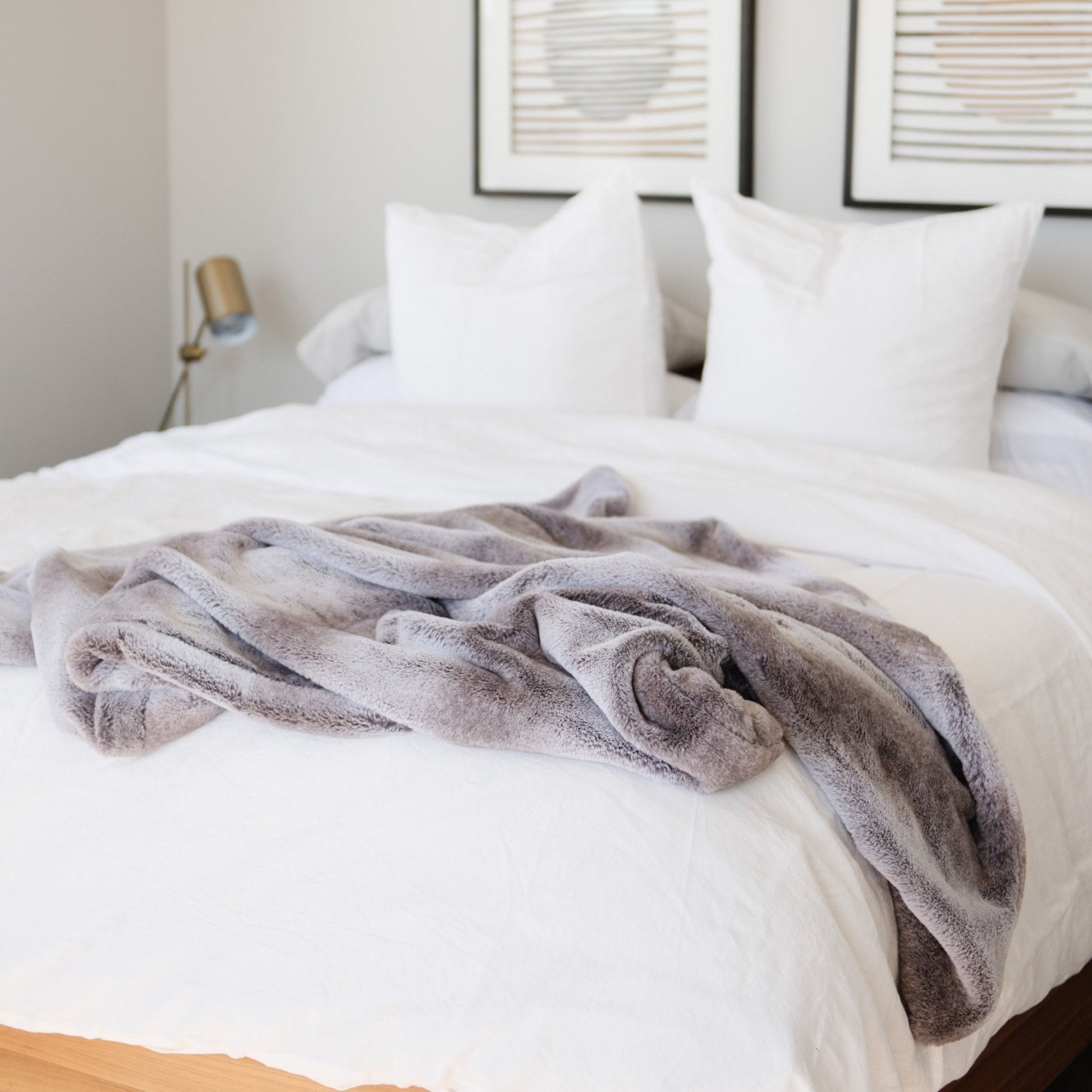 A Saranoni Grand Faux Fur blanket, featuring an elegant white and gray and brown tone and luxuriously soft texture. This cozy, throw blanket and faux fur blanket offers soothing weight, premium softness, timeless comfort, and is a soft blanket. Perfect as a cozy blanket and luxury blanket for snuggling or as a luxury bedroom accent, this Saranoni blanket elevates every cozy moment and is a cozy blanket.