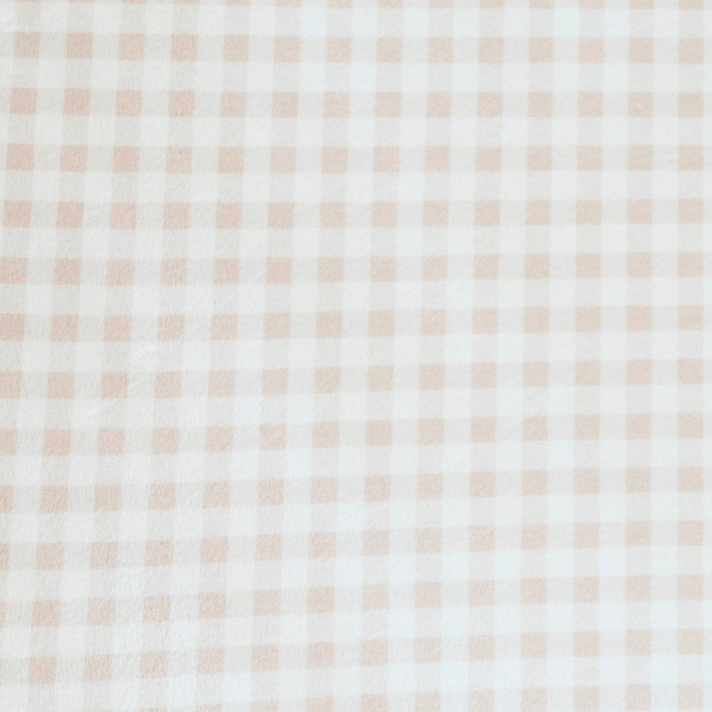 Close-up of Minky Stretch Luxe fabric in a delicate gingham pattern. Made from 94% polyester and 6% spandex, this ultra-soft, stretchy fabric is perfect for baby essentials like swaddles, changing pad covers, and crib sheets.