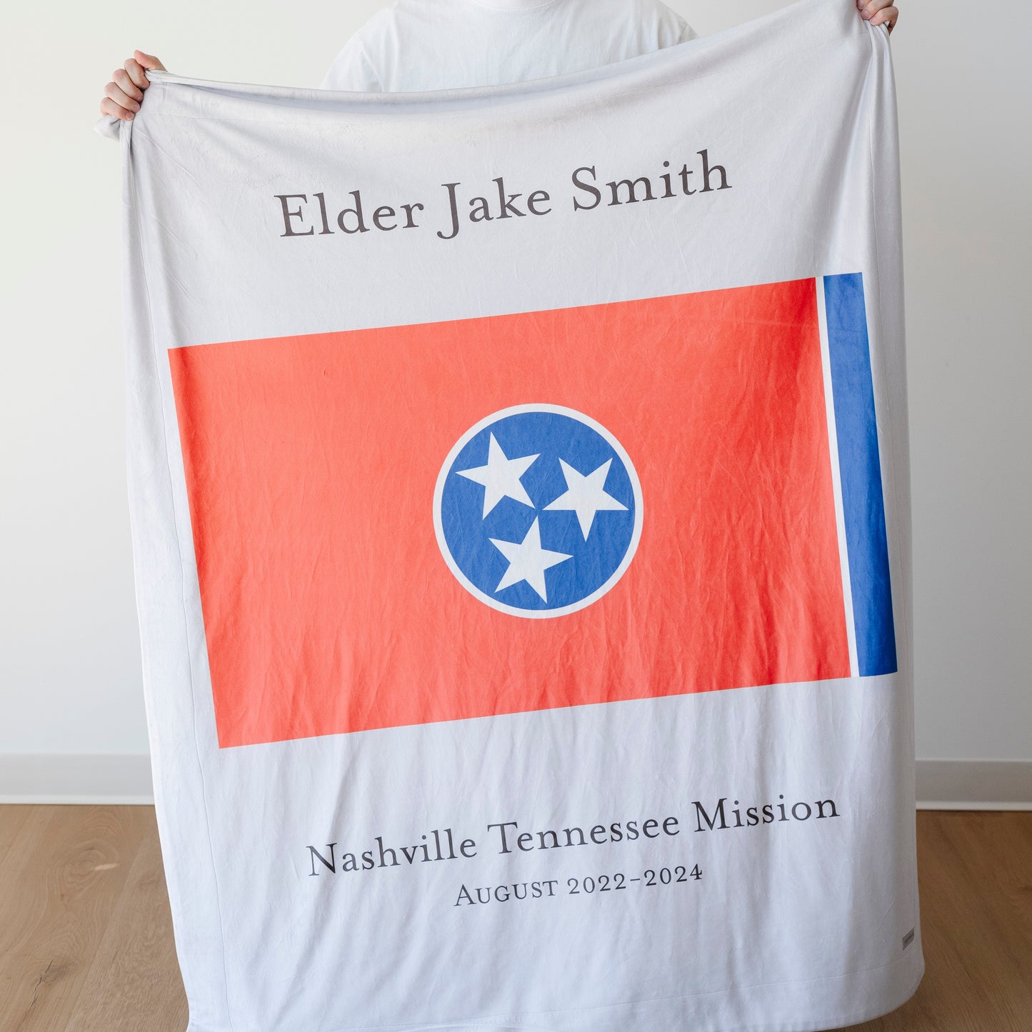 Personalized missionary blanket featuring the Nashville Tennessee Mission flag, missionary name, and custom mission dates.