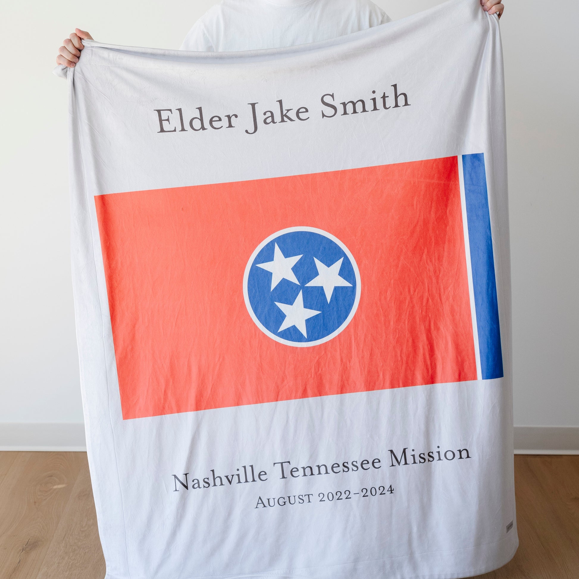 Personalized missionary blanket featuring the Nashville Tennessee Mission flag, missionary name, and custom mission dates.